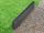 Rasenkante Basalt Takeda mit Rasen und Kies