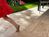 Terrassenplatten Travertin Medium Select mit rennendem Kind